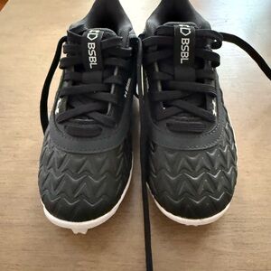 Under Armour Kids Black Cleats with White Soles